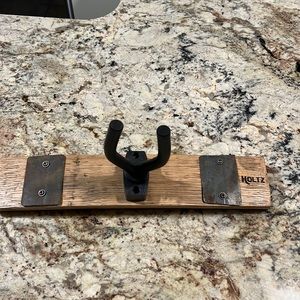 Brand new Holtz Leather whiskey barrel guitar holder.